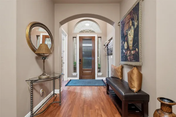a view of a livingroom with furniture and wooden floor