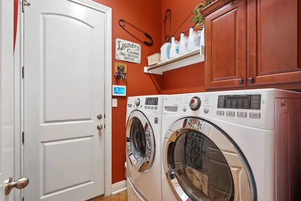 a kitchen with stainless steel appliances granite countertop a stove refrigerator and cabinets