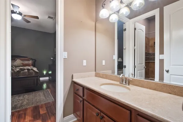 a kitchen with a dining table chairs and sink