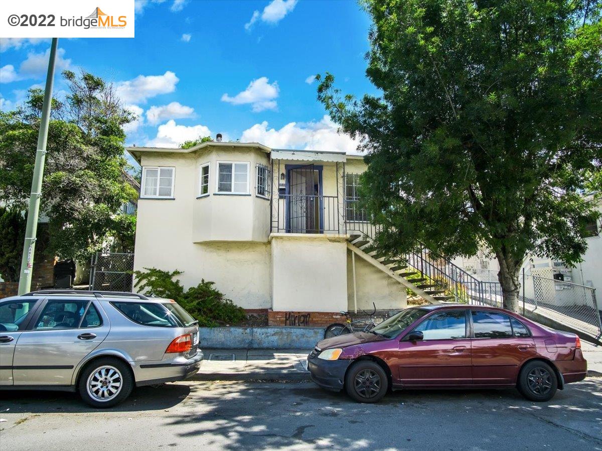 a front view of a house with parking space