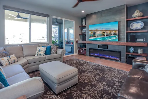 a kitchen with a dining table chairs refrigerator and cabinets