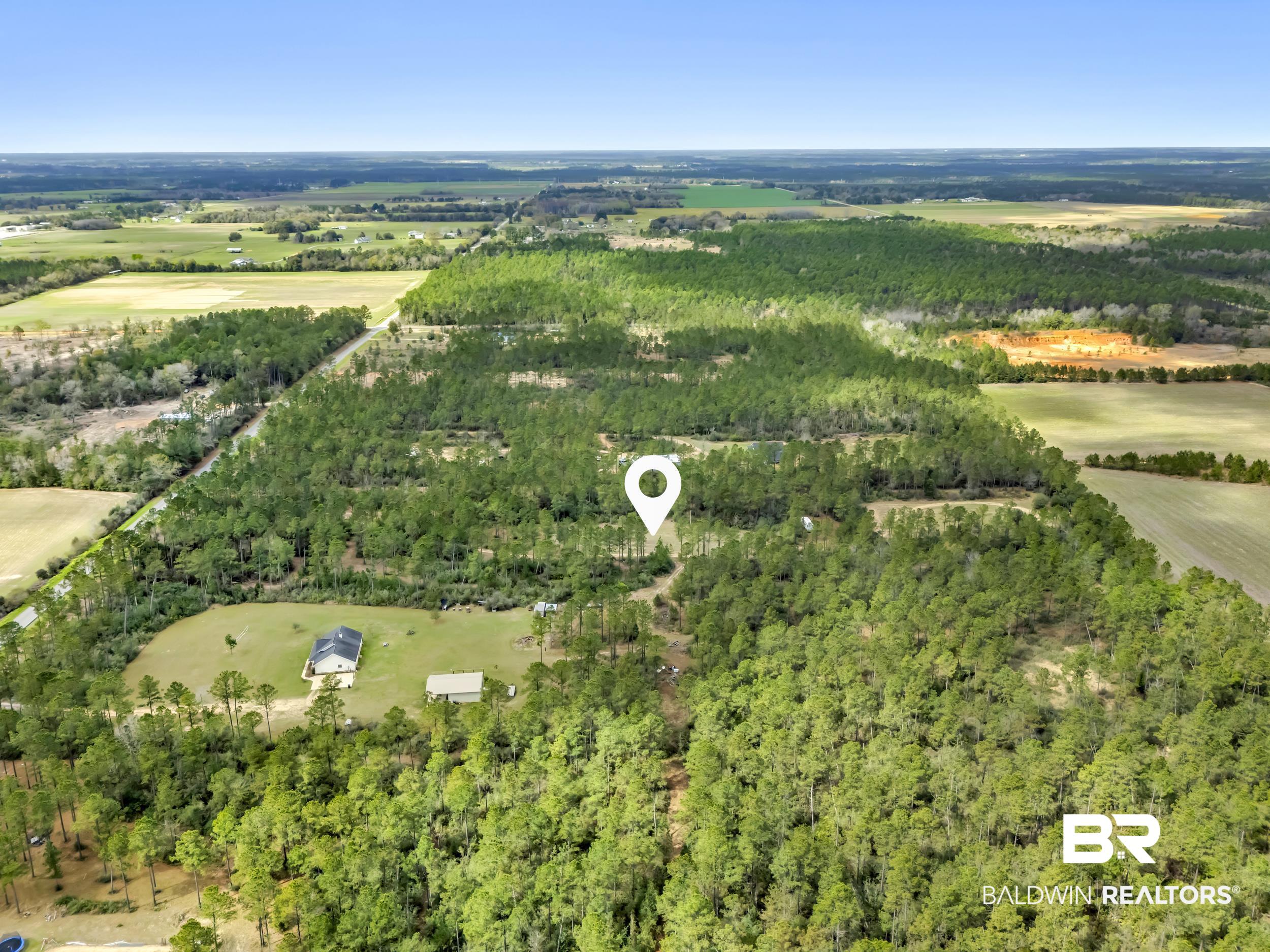 0 Gardner Road Elberta, AL 36530 - Photo 6 of 19 Aerial view of sparsely populated area featuring a heavily wooded area