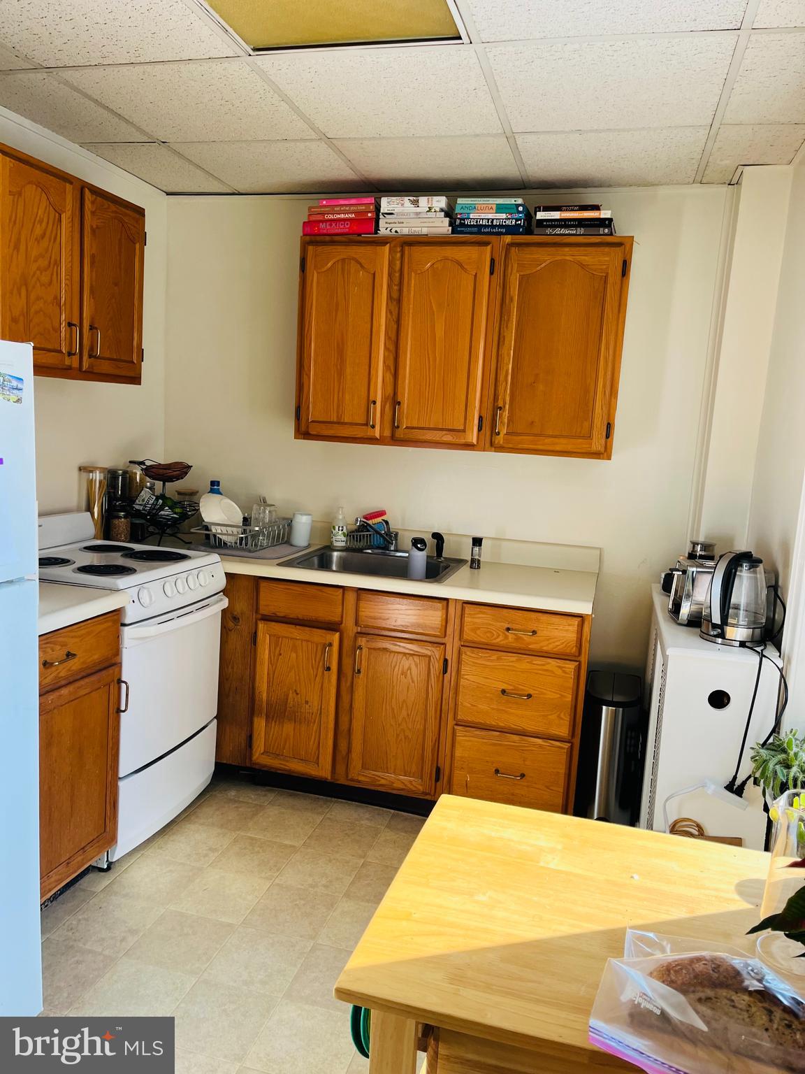 13 South Chester Road Swarthmore, PA 19081 - Photo 20 of 48 a kitchen with a sink a stove and cabinets