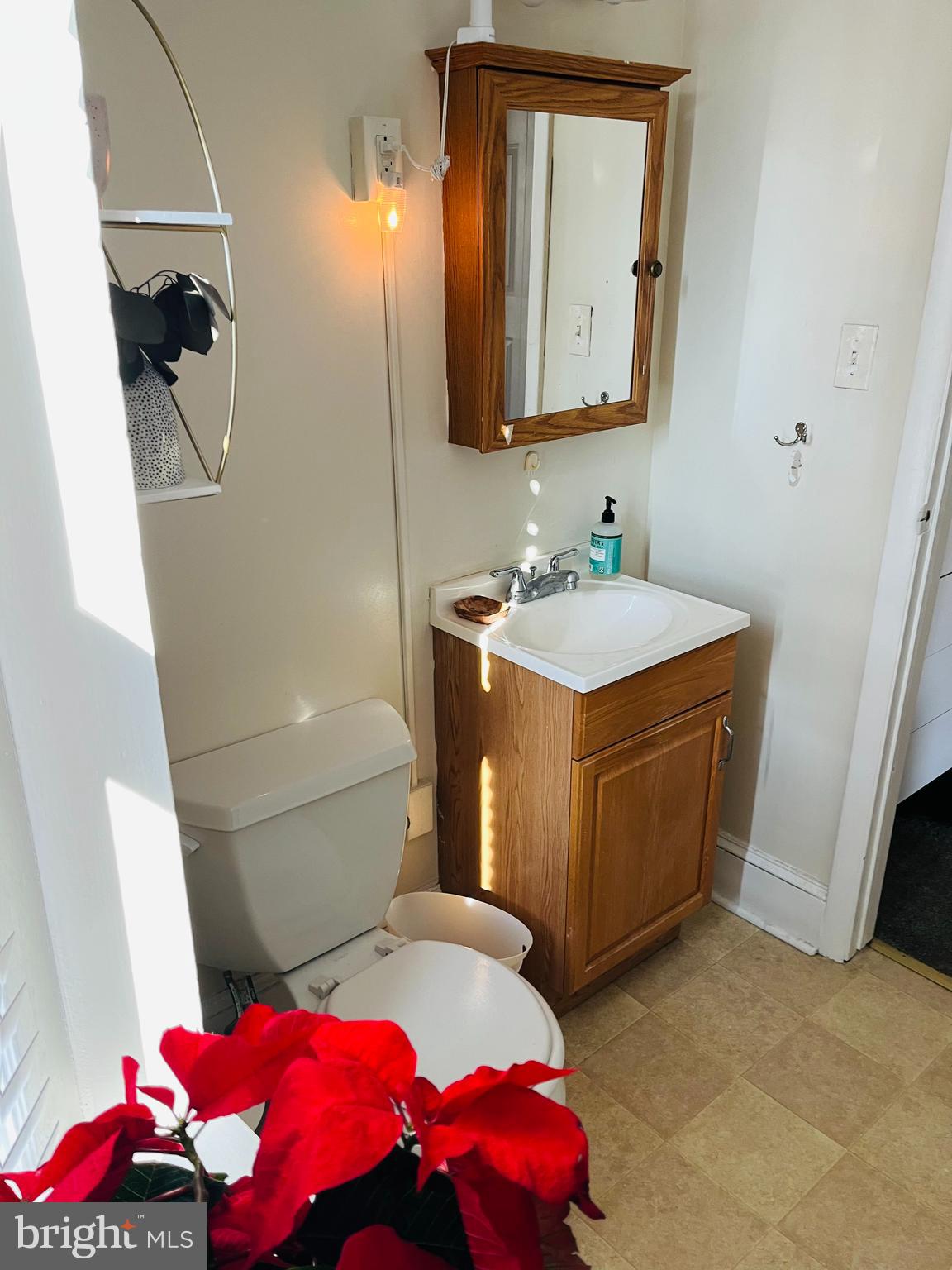 13 South Chester Road Swarthmore, PA 19081 - Photo 22 of 48 a bathroom with a sink mirror vanity and toilet