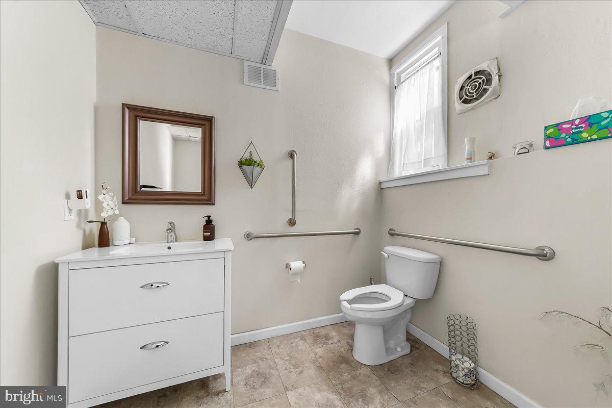 13 South Chester Road Swarthmore, PA 19081 - Photo 33 of 48 a bathroom with a toilet sink and mirror