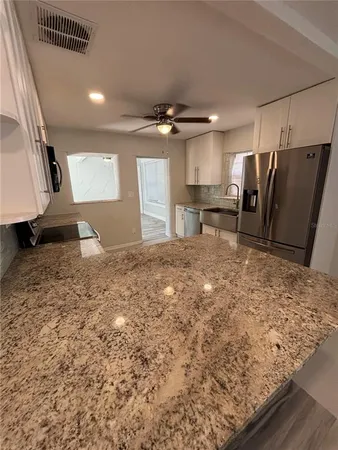 a view of a kitchen with a sink