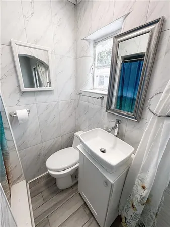 a bathroom with a bathtub and shower