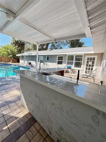 a view of living room kitchen and entryway