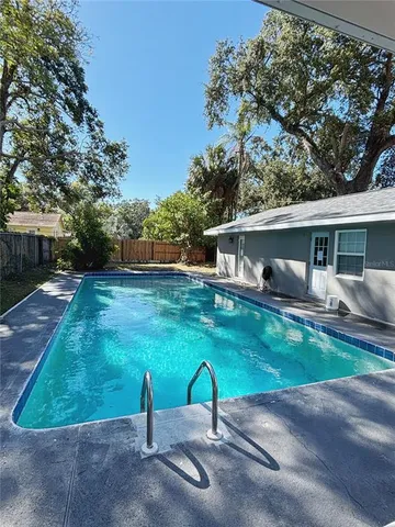 a view of a backyard with green space