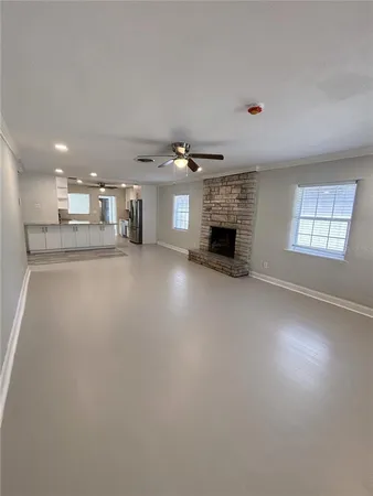 a large kitchen with kitchen island a sink stainless steel appliances and cabinets