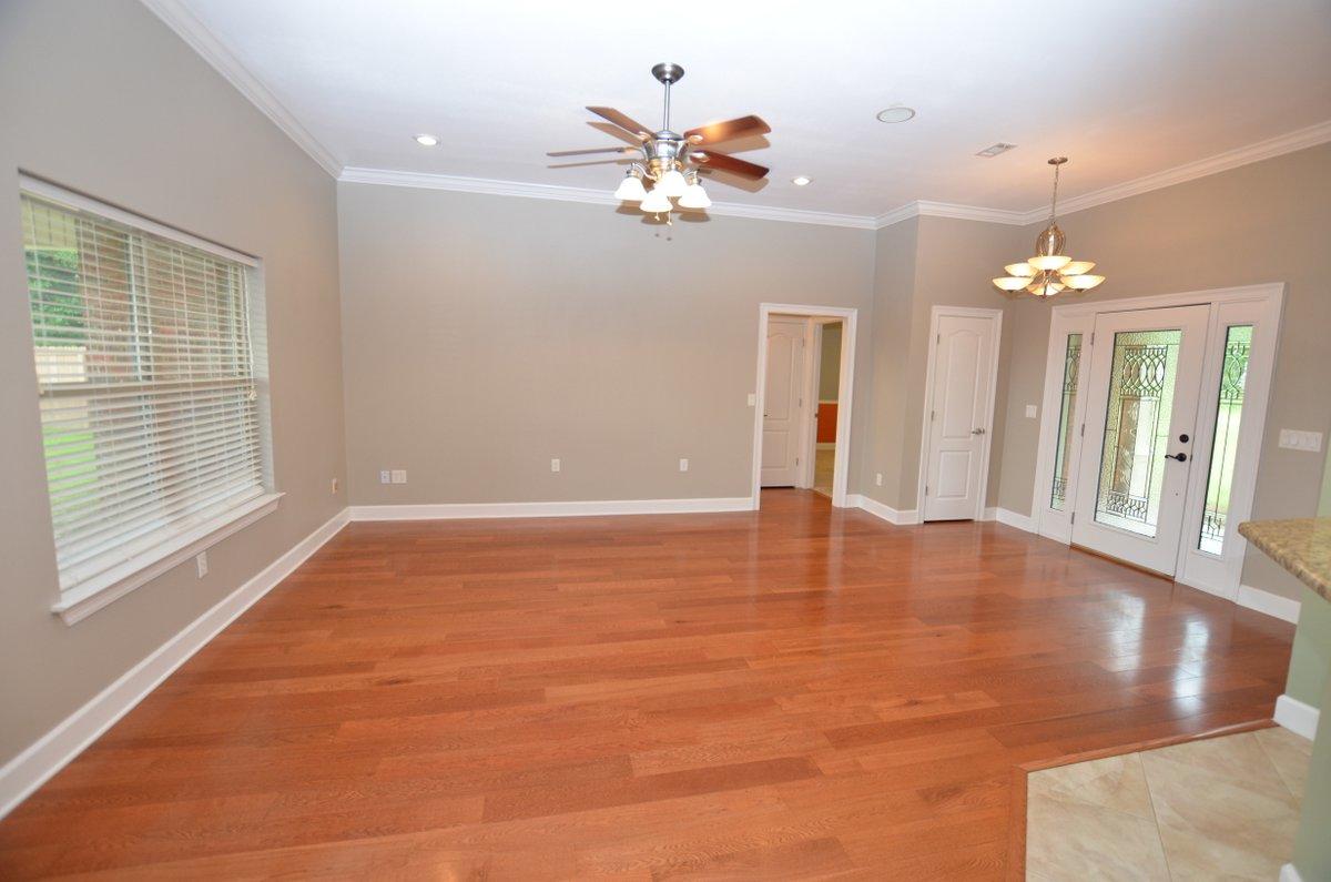 5952 Old Bethel Road Crestview, FL 32536 - Photo 3 of 25 an empty room with chandelier fan and windows