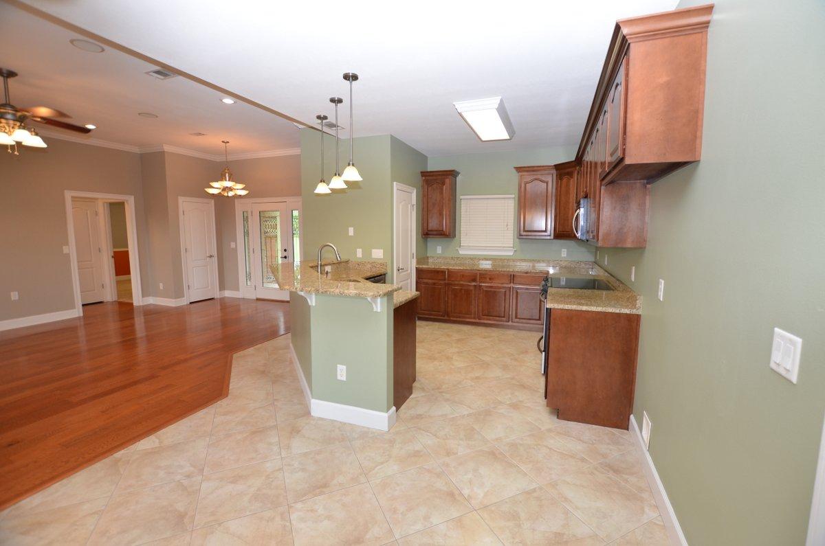 5952 Old Bethel Road Crestview, FL 32536 - Photo 5 of 25 a view of a kitchen with kitchen island a sink stainless steel appliances and cabinets