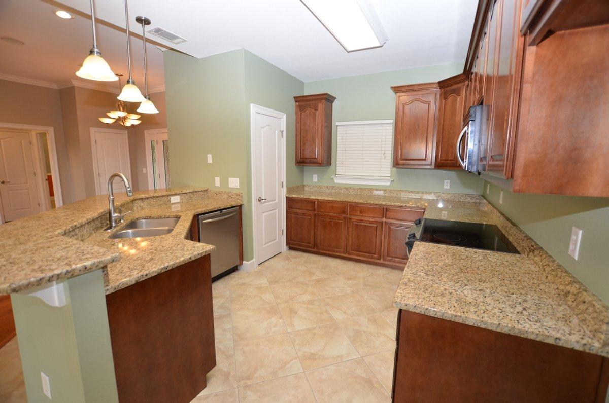 5952 Old Bethel Road Crestview, FL 32536 - Photo 6 of 25 a kitchen with a sink a counter top space and cabinets