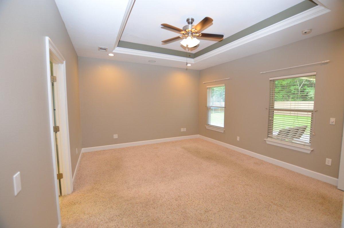 5952 Old Bethel Road Crestview, FL 32536 - Photo 10 of 25 an empty room with windows and ceiling fan