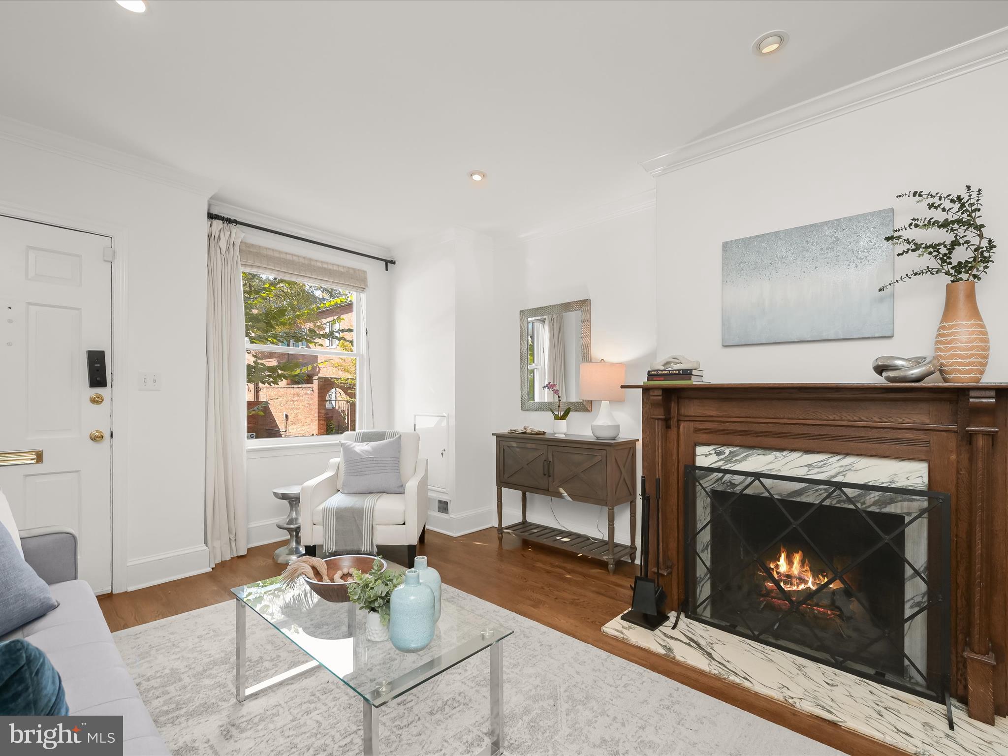3407 Q Street Northwest Washington, DC 20007 - Photo 5 of 27 a living room with furniture and a fireplace