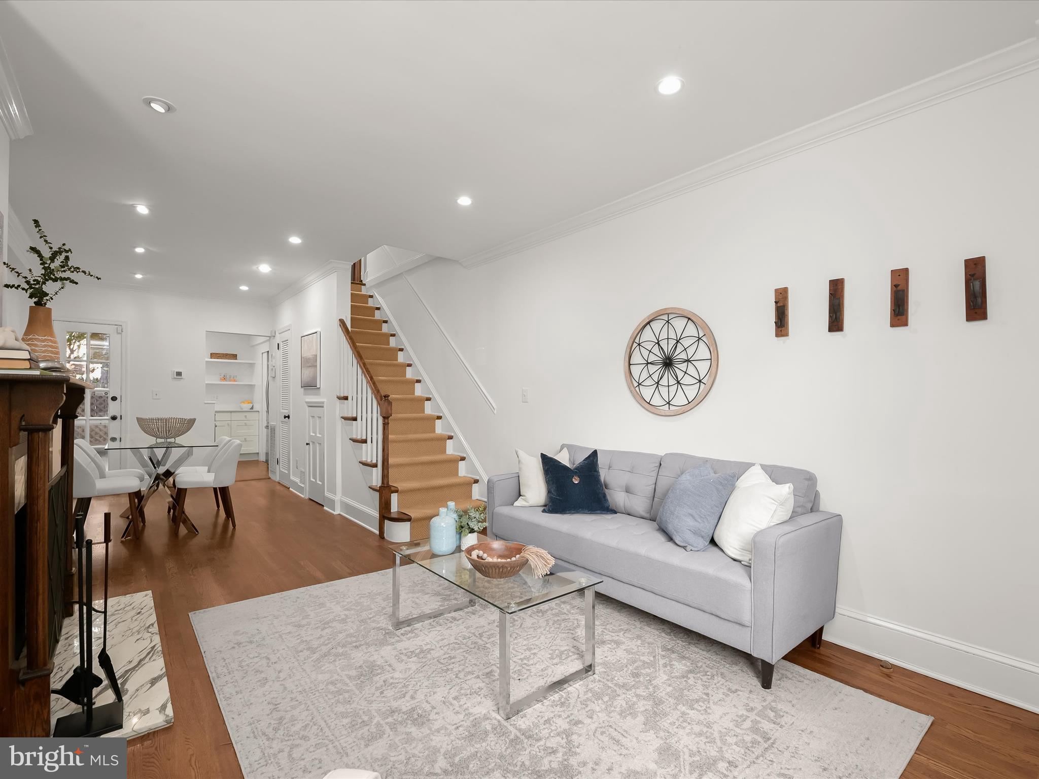 3407 Q Street Northwest Washington, DC 20007 - Photo 8 of 27 a living room with furniture a rug and a floor