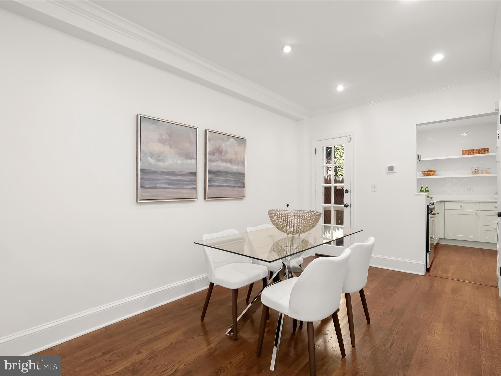 3407 Q Street Northwest Washington, DC 20007 - Photo 9 of 27 a view of a dining room with furniture and wooden floor