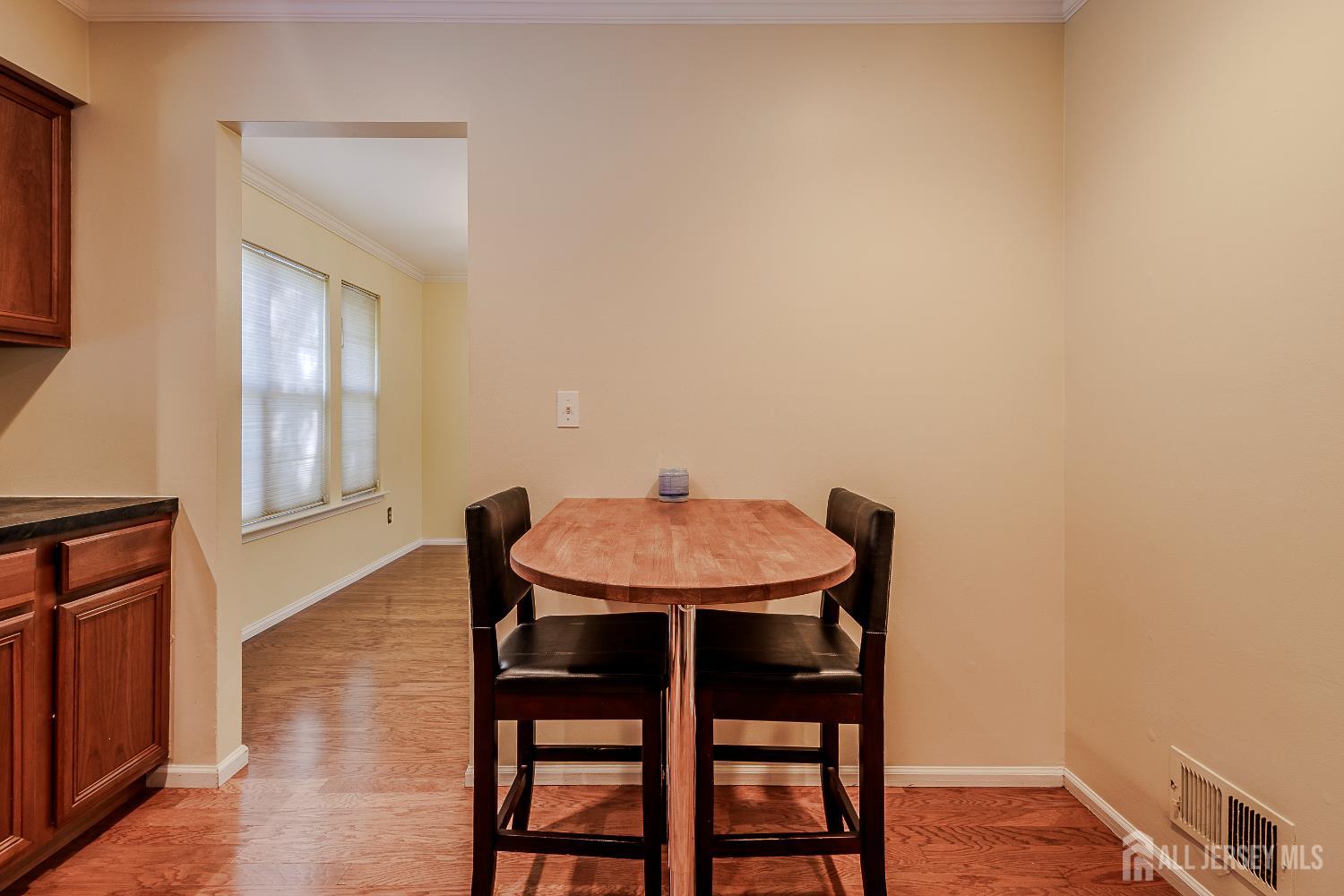 412 Hawkshead Way Somerset, NJ 08873 - Photo 11 of 35 a dining room with furniture and wooden floor