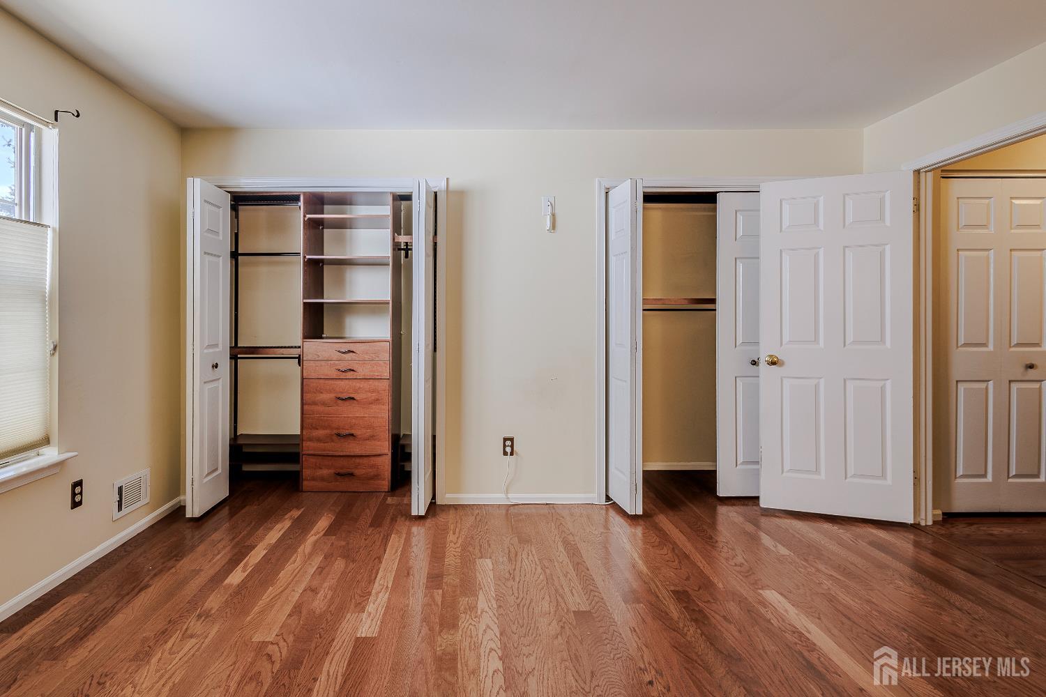 412 Hawkshead Way Somerset, NJ 08873 - Photo 21 of 35 an empty room with wooden floor and closet