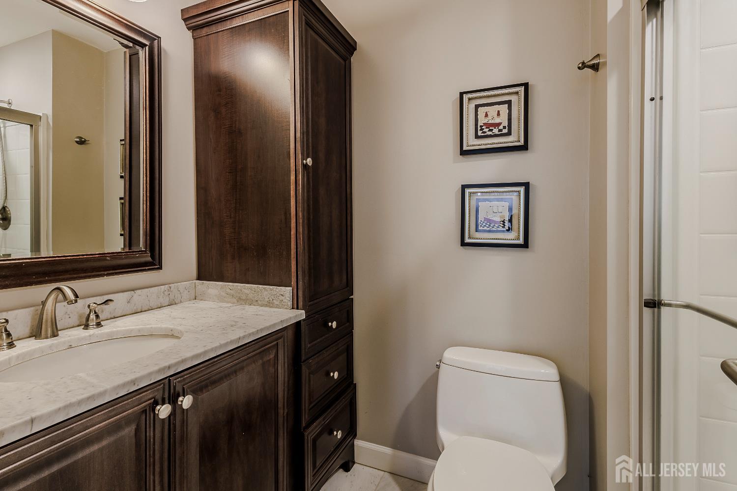 412 Hawkshead Way Somerset, NJ 08873 - Photo 23 of 35 a bathroom with a granite countertop toilet sink and mirror