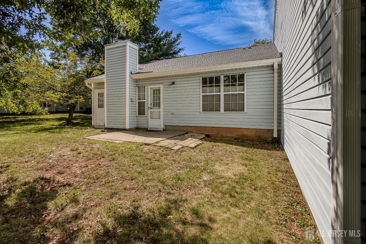 412 Hawkshead Way Somerset, NJ 08873 - Photo 26 of 35 a view of backyard with large trees and wooden fence