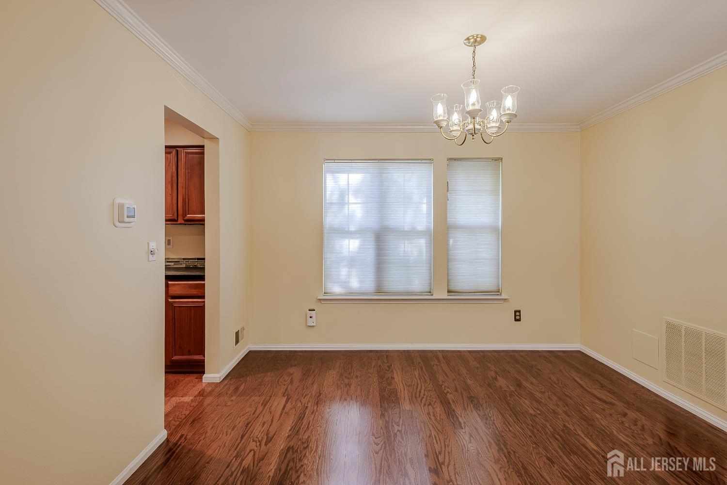 412 Hawkshead Way Somerset, NJ 08873 - Photo 6 of 35 wooden floor in an empty room with a window
