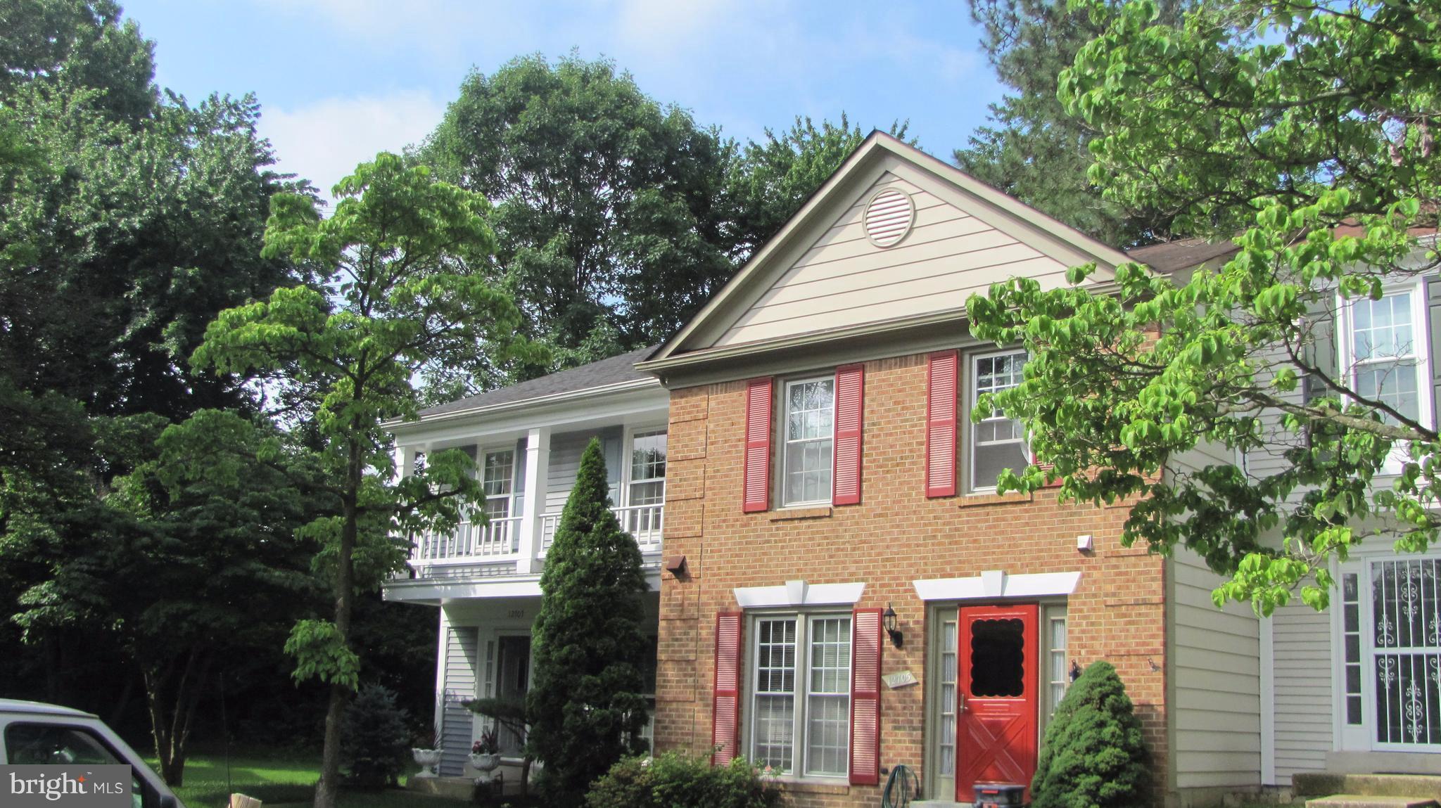 12705 Turquoise Terrace Silver Spring, MD 20904 - Photo 1 of 24 a front view of a house with plants and trees