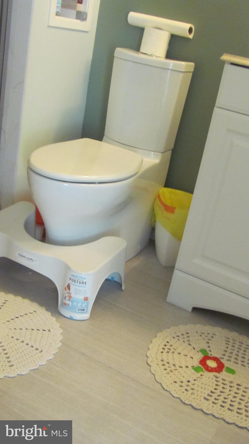12705 Turquoise Terrace Silver Spring, MD 20904 - Photo 12 of 24 a white toilet sitting next to a sink