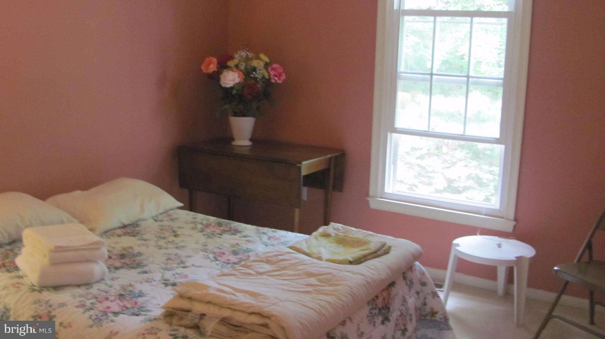 12705 Turquoise Terrace Silver Spring, MD 20904 - Photo 18 of 24 a bedroom with a bed and a window