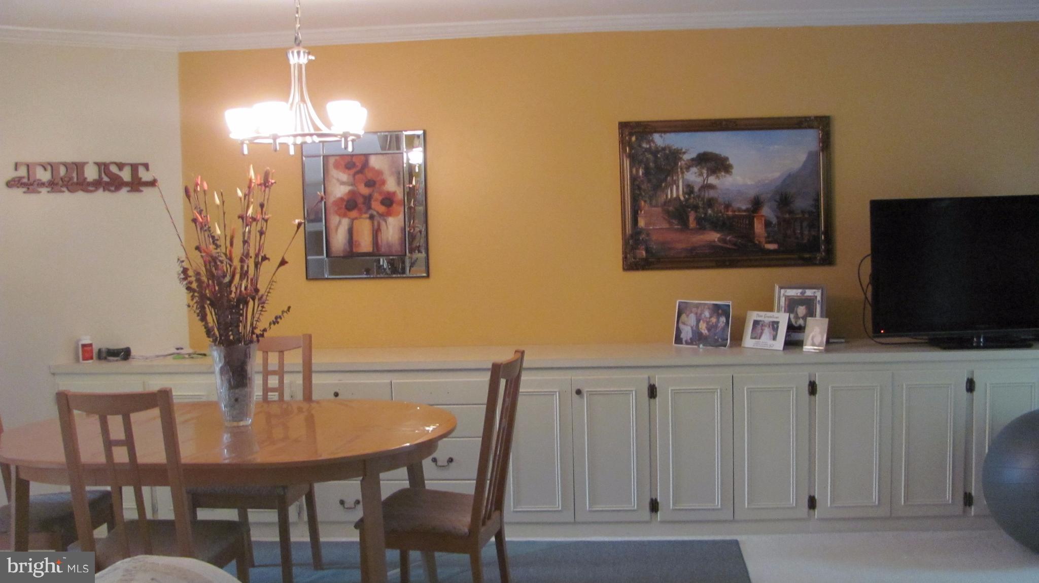 12705 Turquoise Terrace Silver Spring, MD 20904 - Photo 21 of 24 a view of a dining room with furniture and wooden floor