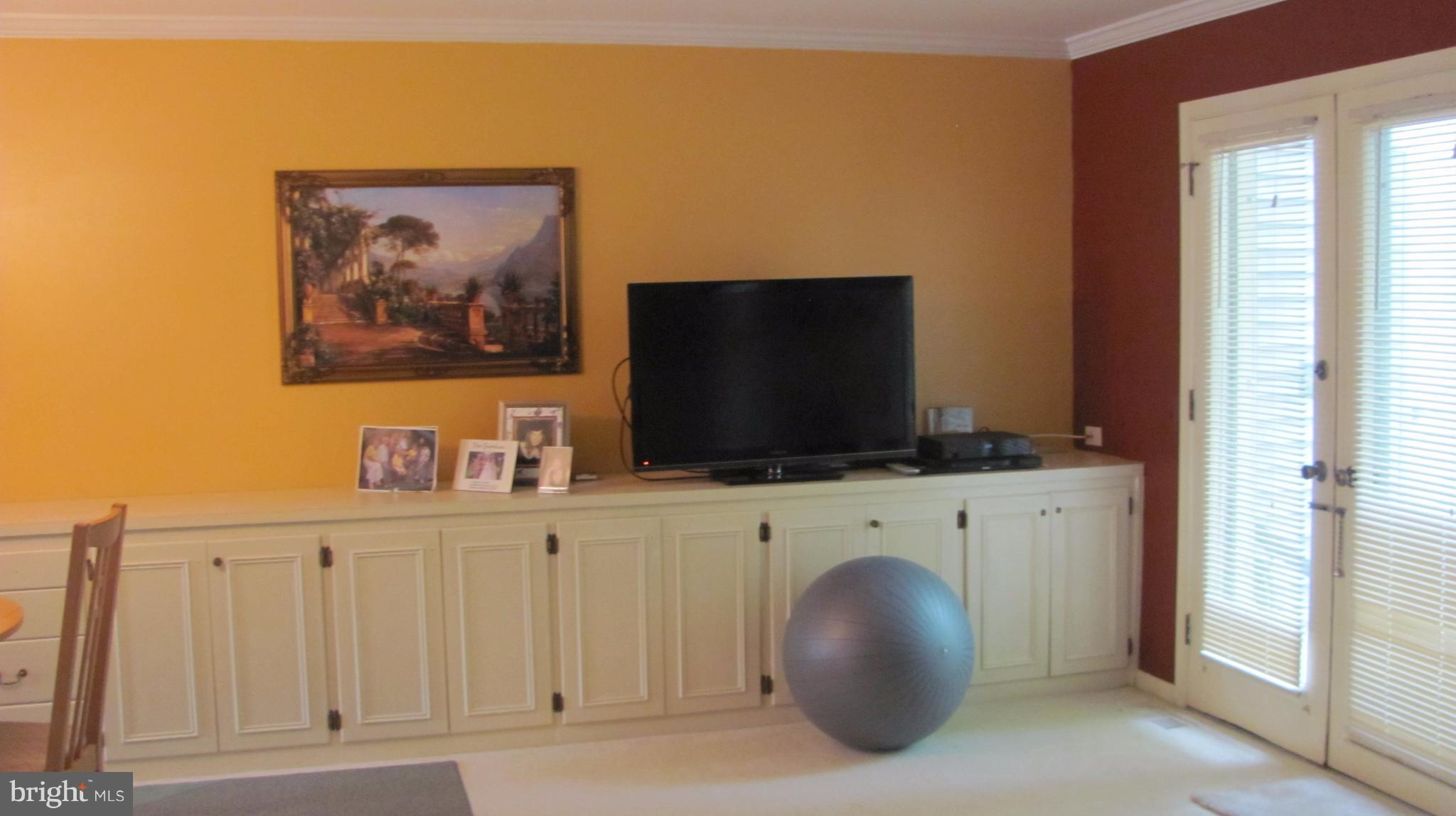 12705 Turquoise Terrace Silver Spring, MD 20904 - Photo 22 of 24 a living room with furniture and a flat screen tv