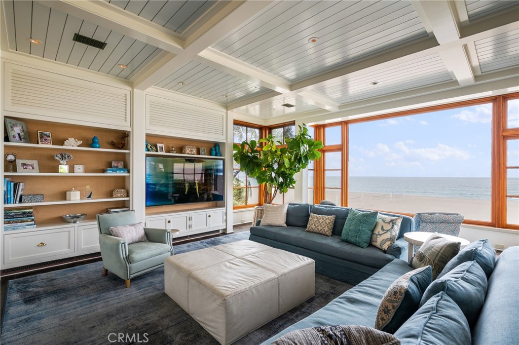 212 The Strand Manhattan Beach, CA 90266 - Photo 13 of 75 a living room with furniture and a flat screen tv