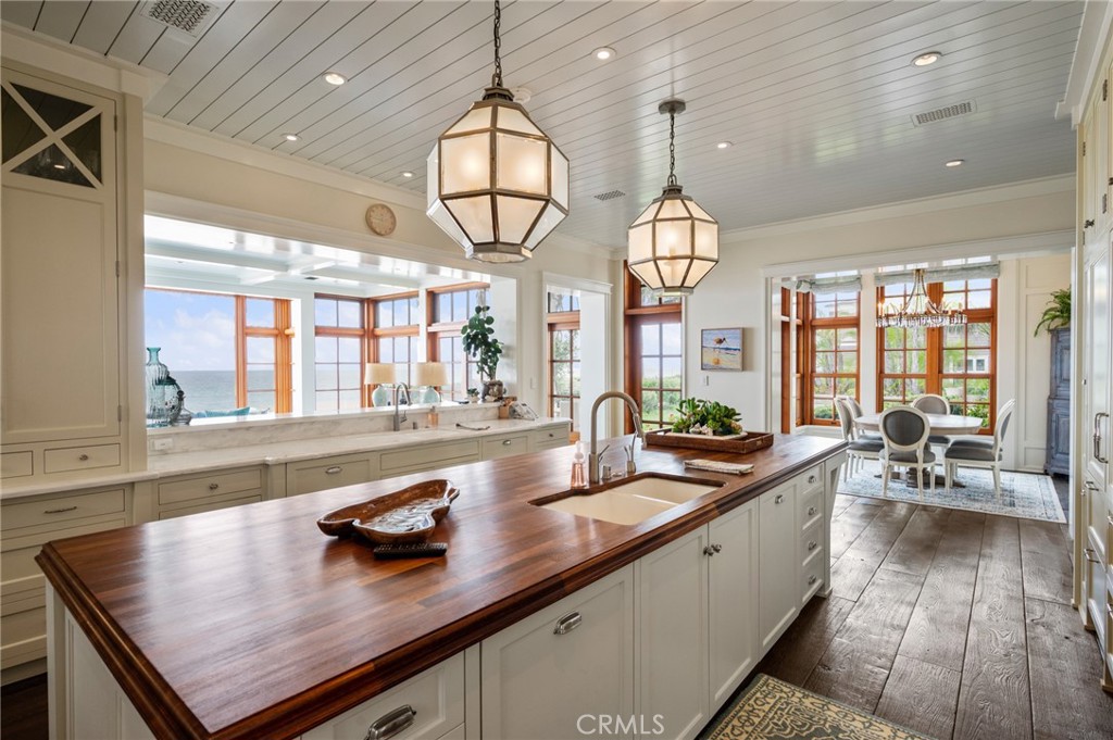 212 The Strand Manhattan Beach, CA 90266 - Photo 16 of 75 a very nice looking kitchen with granite countertop a large window