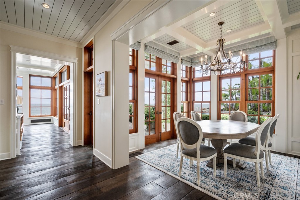 212 The Strand Manhattan Beach, CA 90266 - Photo 23 of 75 a dining room with furniture a chandelier and wooden floor