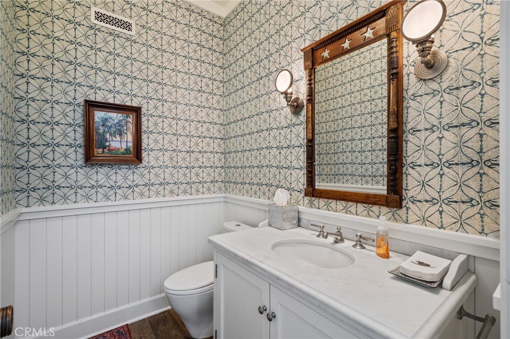 212 The Strand Manhattan Beach, CA 90266 - Photo 30 of 75 a bathroom with a sink toilet and vanity