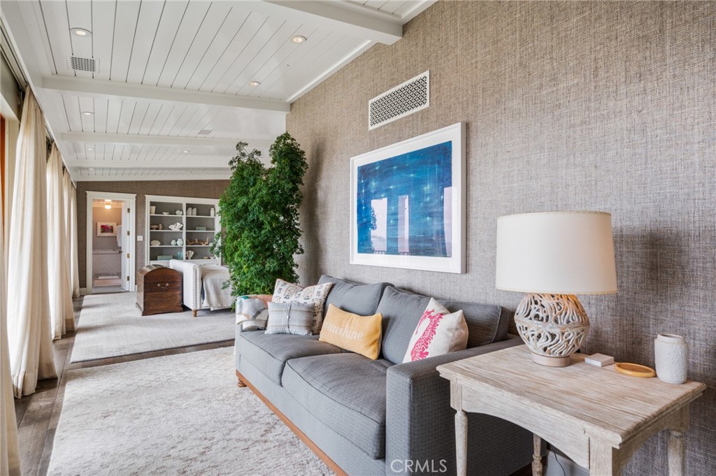 212 The Strand Manhattan Beach, CA 90266 - Photo 37 of 75 a living room with furniture and a potted plant