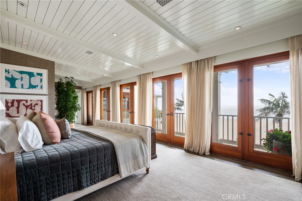212 The Strand Manhattan Beach, CA 90266 - Photo 40 of 75 a bedroom with a large bed and a large window
