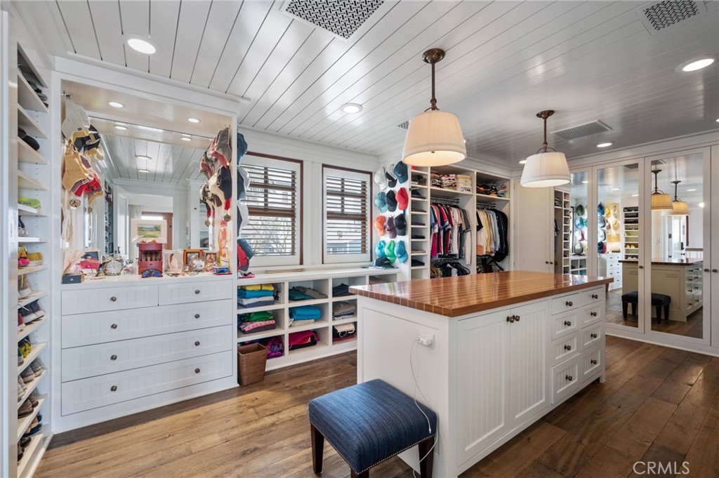 212 The Strand Manhattan Beach, CA 90266 - Photo 41 of 75 a kitchen that has a lot of cabinets in it and wooden floors