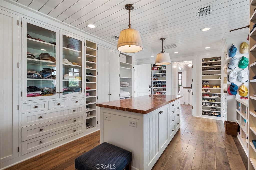 212 The Strand Manhattan Beach, CA 90266 - Photo 42 of 75 a kitchen with stainless steel appliances cabinets and a wooden floor