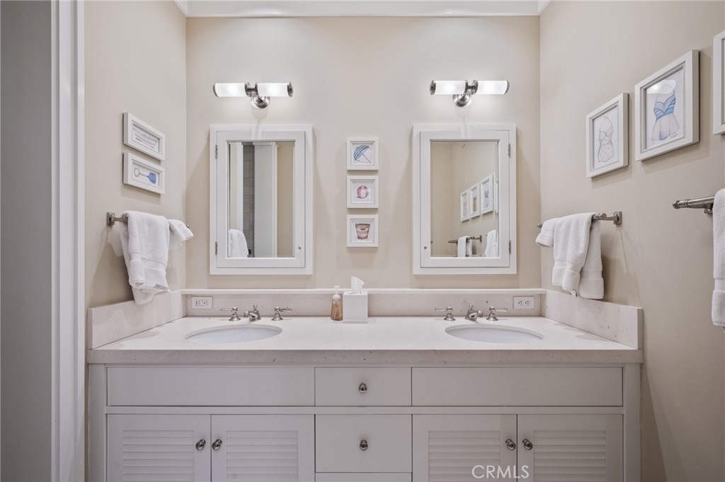 212 The Strand Manhattan Beach, CA 90266 - Photo 47 of 75 a bathroom with a sink and a mirror