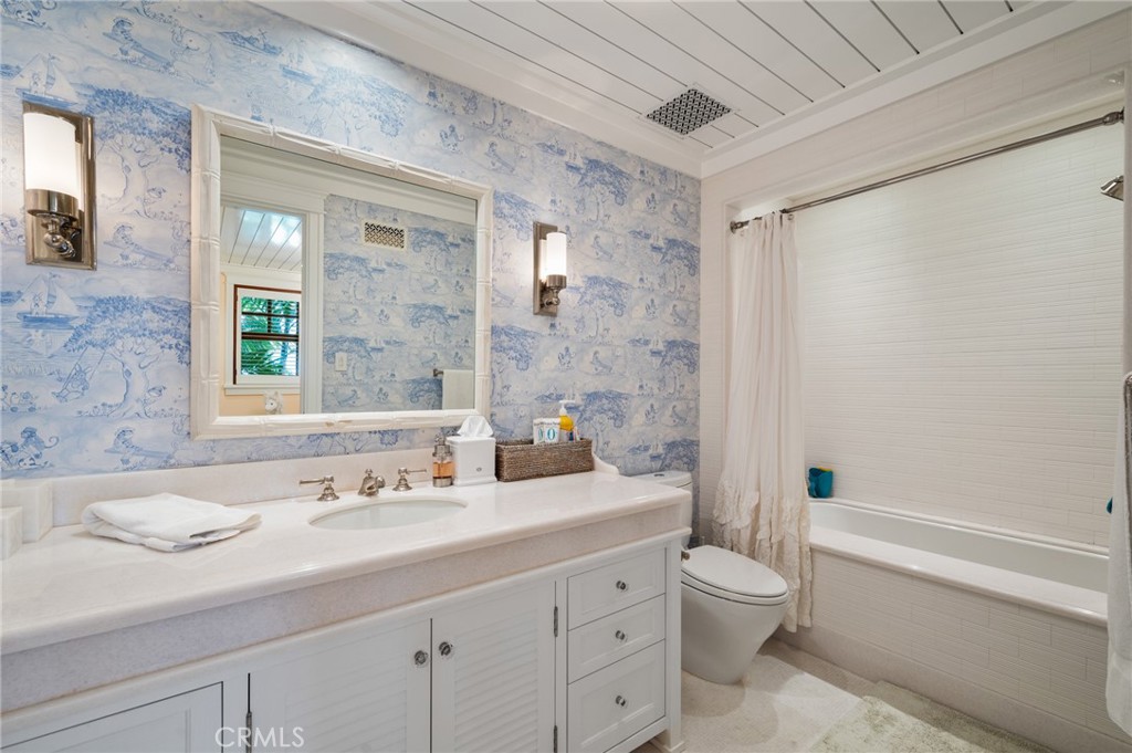 212 The Strand Manhattan Beach, CA 90266 - Photo 49 of 75 a bathroom with a sink a toilet and shower