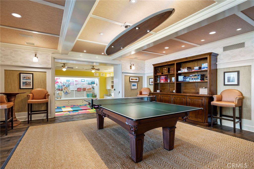 212 The Strand Manhattan Beach, CA 90266 - Photo 60 of 75 a living room with furniture a table and a flat screen tv