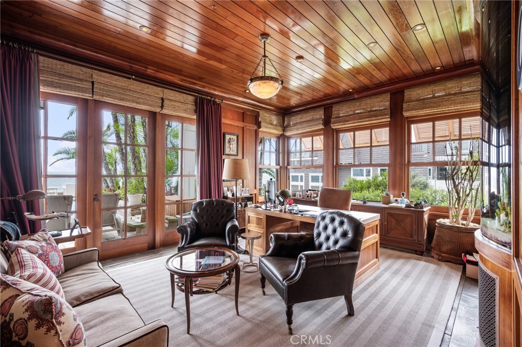 212 The Strand Manhattan Beach, CA 90266 - Photo 6 of 75 a living room with furniture and floor to ceiling windows