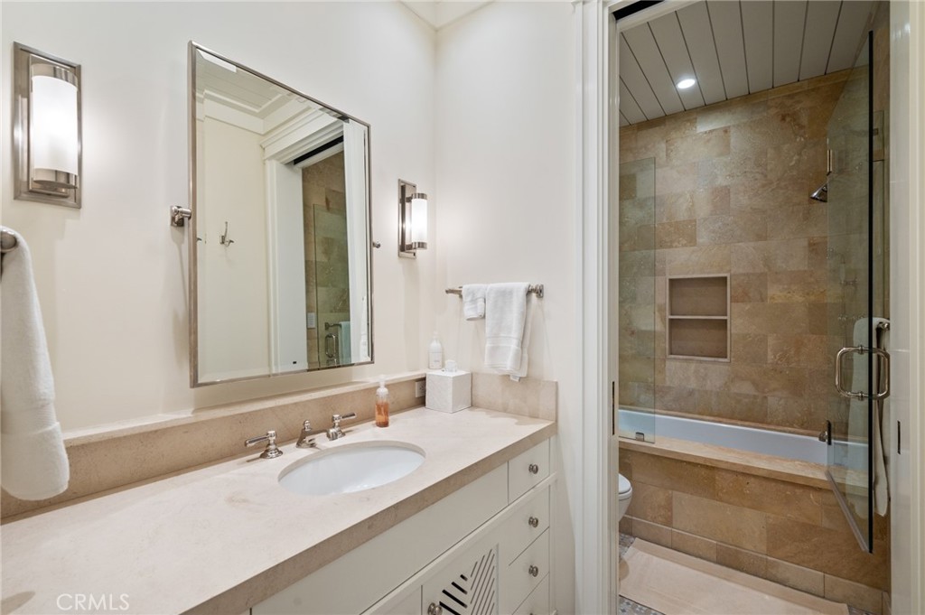 212 The Strand Manhattan Beach, CA 90266 - Photo 63 of 75 a bathroom with a granite countertop sink mirror and shower