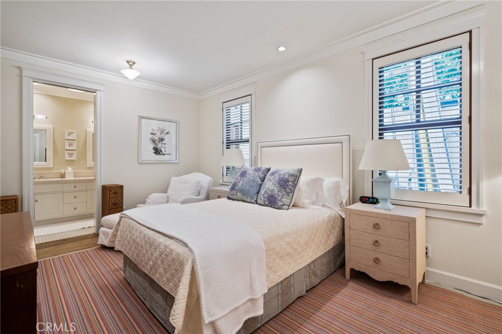 212 The Strand Manhattan Beach, CA 90266 - Photo 64 of 75 a bedroom with a bed and a window