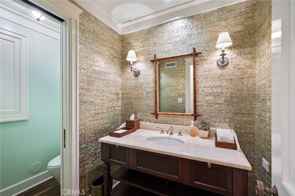 212 The Strand Manhattan Beach, CA 90266 - Photo 67 of 75 a bathroom with a sink and a mirror