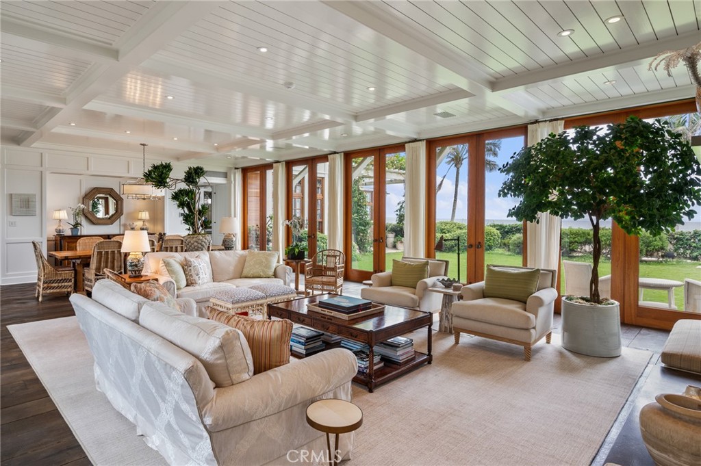 212 The Strand Manhattan Beach, CA 90266 - Photo 7 of 75 a living room with furniture and large windows