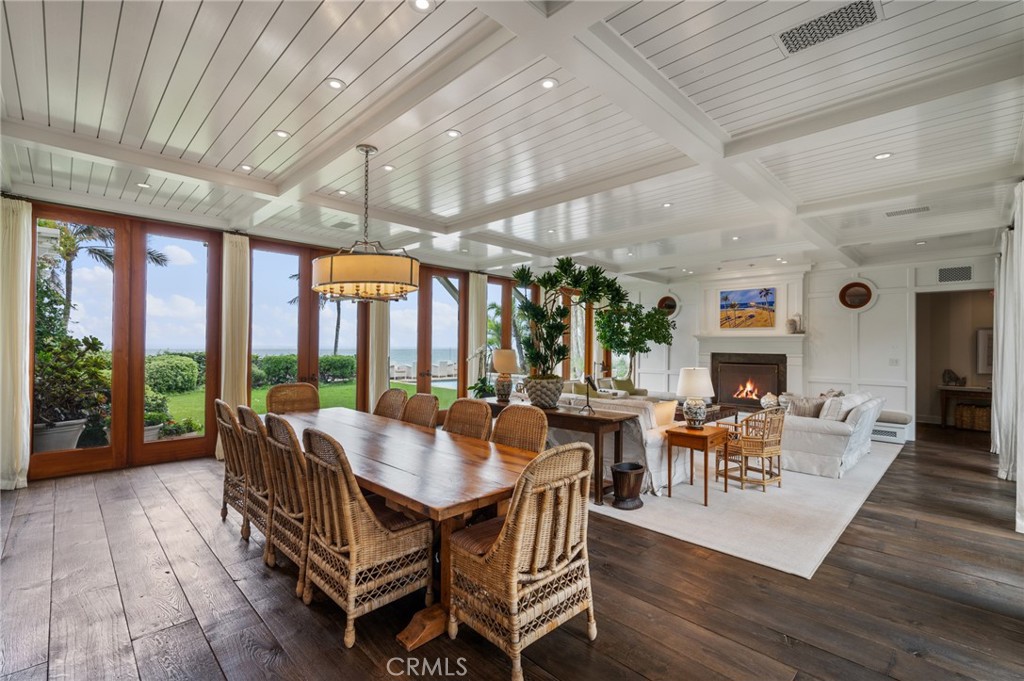 212 The Strand Manhattan Beach, CA 90266 - Photo 8 of 75 a dining room with wooden floor and furniture