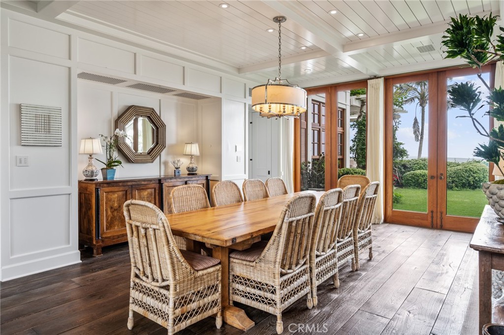 212 The Strand Manhattan Beach, CA 90266 - Photo 10 of 75 a dining room with furniture a chandelier and wooden floor