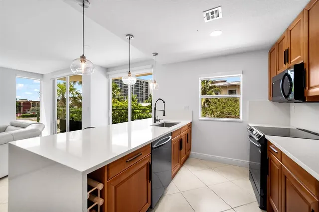 a kitchen with sink and window